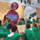 Escolares tocan una pantalla interactiva sobre el aceite de orujo de oliva en el museo interactivo del CIVA